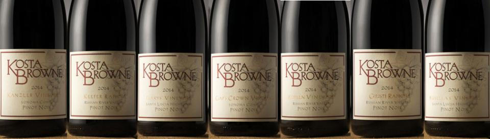 Row of Kosta Browne Pinot Noir bottles with their labels